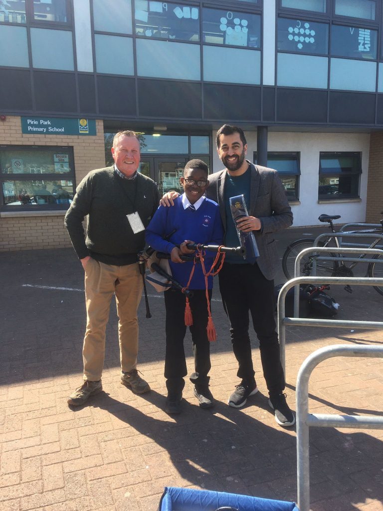 Humza with student and piper from Govan School and Community Pipe Band