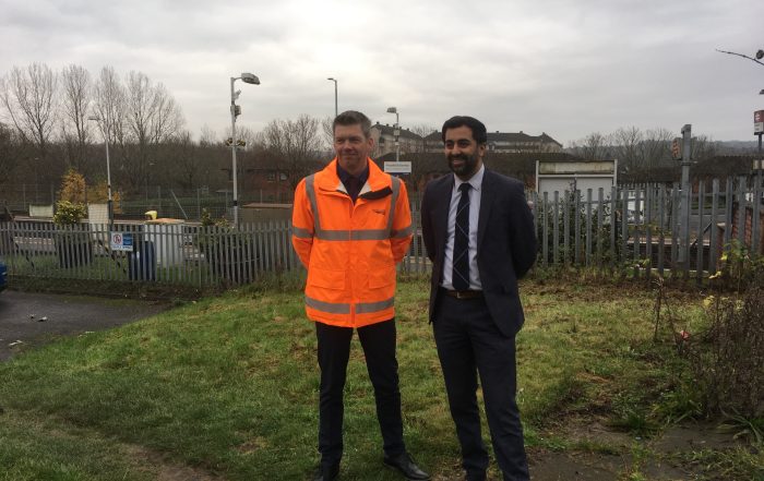 Humza Yousaf MSP standing at Priesthill and Darnley Train Station with Network Rail representative